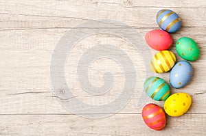 Colorful perfect handmade painted easter eggs on a wood background