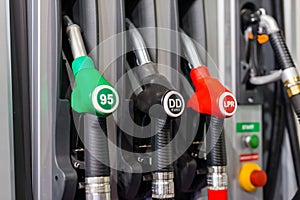 Colorful Petrol pump filling nozzles , Gas station in a service