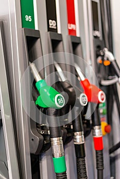 Colorful Petrol pump filling nozzles , Gas station in a service