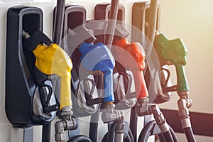 Colorful Petrol pump filling nozzles, Gas station in a service