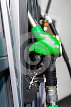 Colorful Petrol pump filling nozzles , Gas station in a service in daytime