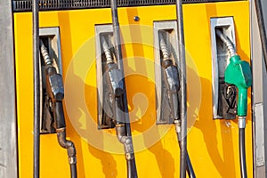 Colorful Petrol pump filling nozzles, Gas station in a service