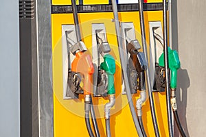 Colorful Petrol pump filling nozzles, Gas station in a service