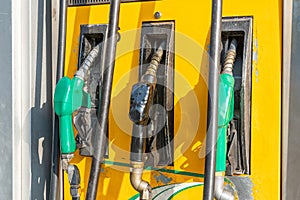 Colorful Petrol pump filling nozzles, Gas station in a service