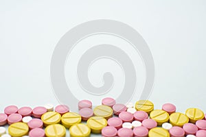 Colorful pharmaceutical medicine pills and tablets different medical drugs on blue background. Medicine flat lay.