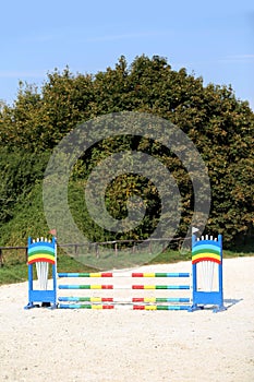 Colorful photo of equestrian obstacles. Empty field for horse jumping event competition