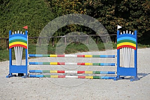 Colorful photo of equestrian obstacles. Empty field for horse jumping event competition