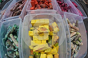 Colorful Pieces Of Chalk Sit In Plastic Containers