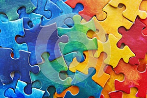 Colorful pieces puzzles background. World autism awareness day concept. Top view