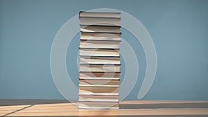 Colorful Pile of Books Against a Blue Background