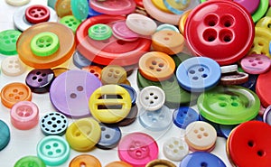 Colorful pile of buttons. Craft background.