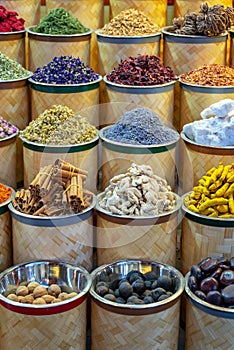 Colorful piles of spices in Dubai souks, UAE photo