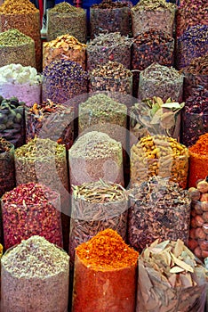 Colorful piles of spices in Dubai souks, UAE photo