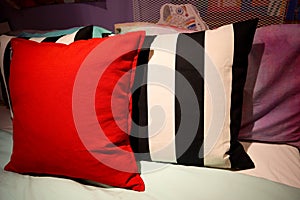 Colorful pillow on the bed photo