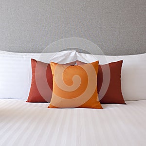 Colorful Pillow on hotel bed with space for text