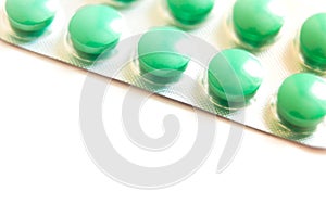 Colorful pills in blister isolated on white background with copy space