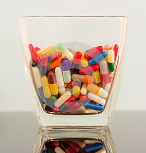 Colorful pills in a large bowl