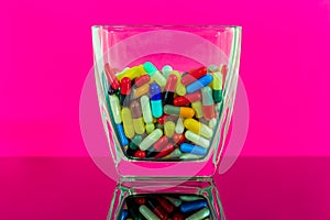 Colorful pills in a large bowl