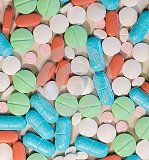 Colorful pills and tablets background frame