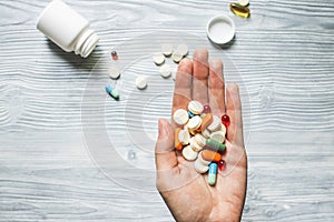 Colorful pills and tablets in the hand