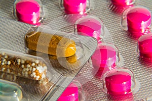 Colorful pills in transparent medicine capsule, nanotechnology future medicine concept