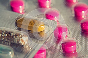 Colorful pills in transparent medicine capsule, nanotechnology future medicine concept