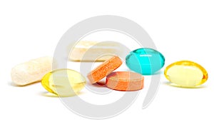 Colorful pills on white background. Bunch of different drugs and pills studio shot. Drug production industry