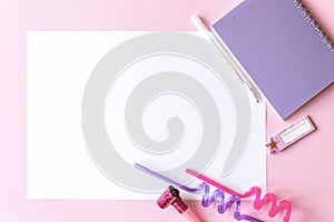 Colorful pink background with party decoration, notebook and free space for text, mock-up. Top view. Learning to draw, making wish