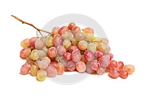 Colorful pink grapes isolated on white background