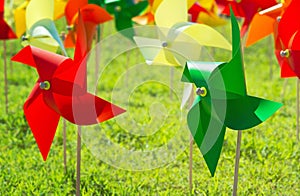 Colorful pinwheel on grass