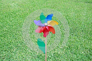 Colorful pinwheel over green grass