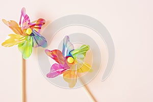 Colorful pinwheel. Plastic windmill children`s toy. Background with copy space. Matte filter added