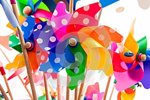 Colorful pinwheels against white background