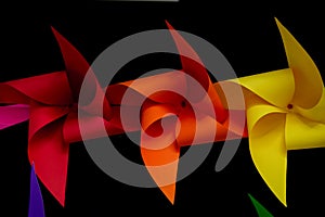 Colorful pinwheels on black background