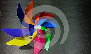 Colorful pinwheels closeup black background