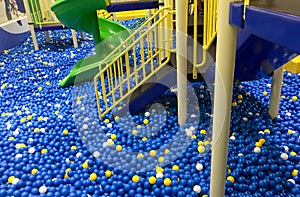 Colorful plastic balls and stair on with slider