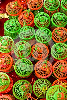 Colorful Plastic Bird Cages in Repetitive Pattern Display
