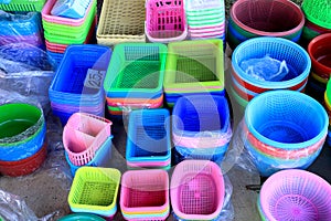 Colorful plastic buckets and containers on display at a sundry s
