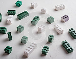 Colorful plastic building blocks scattered on a white background