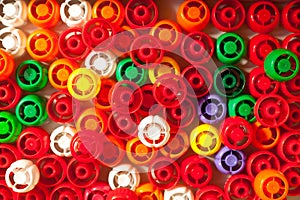 colorful plastic caps from bottles background. Recycling collection and production processing.
