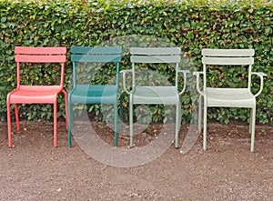 Colorful plastic chairs in the park