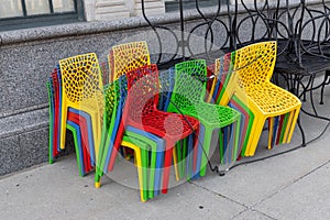 Colorful plastic chairs tied together