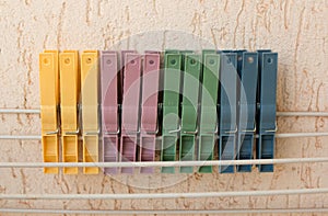 Colorful Clothespins lined up in a Row