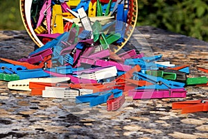 Colorful plastic clothespins, stand on the table