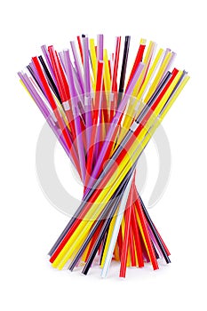 Colorful plastic cocktail straws, many plastic drinking pipes, plastic tubes for beverages on white background isolated close up