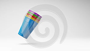 Colorful Plastic Cups Spinning on Studio Light Gray Background