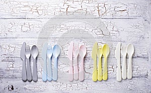 Colorful plastic forks, spoons and knives