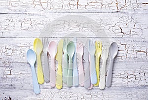 Colorful plastic forks, spoons and knives