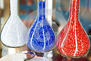 Colorful plastic granular polymer in glass