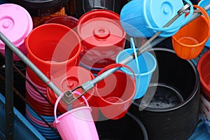 Colorful plastic made bowl and buckets selling on local market.